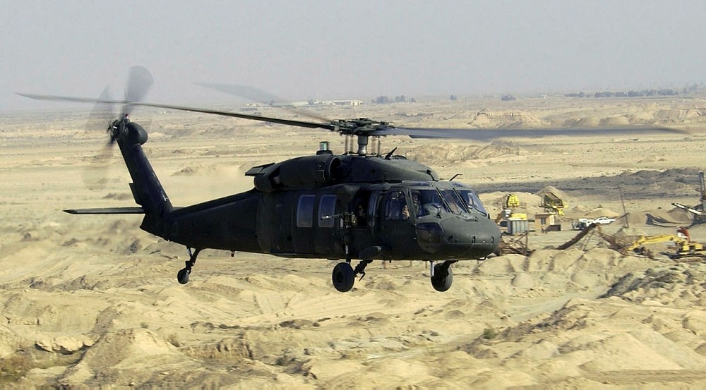 A US Army (USA) UH-60L Black hawk Helicopter flies a low-level mission over Iraq during Operation IRAQI FREEDOM.