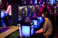 This file photo taken on September 21, 2018 shows visitors playing Sony's video game ,Call of Duty, at the Tokyo Game Show. (AFP Photo)