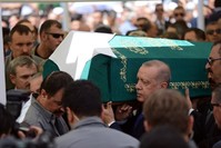 President Recep Tayyip Erdou011fan carries the coffin of u015eule Yu00fcksel u015eenler after funeral prayers at Eyu00fcpsultan Mosque in Istanbul, Aug. 29, 2019.