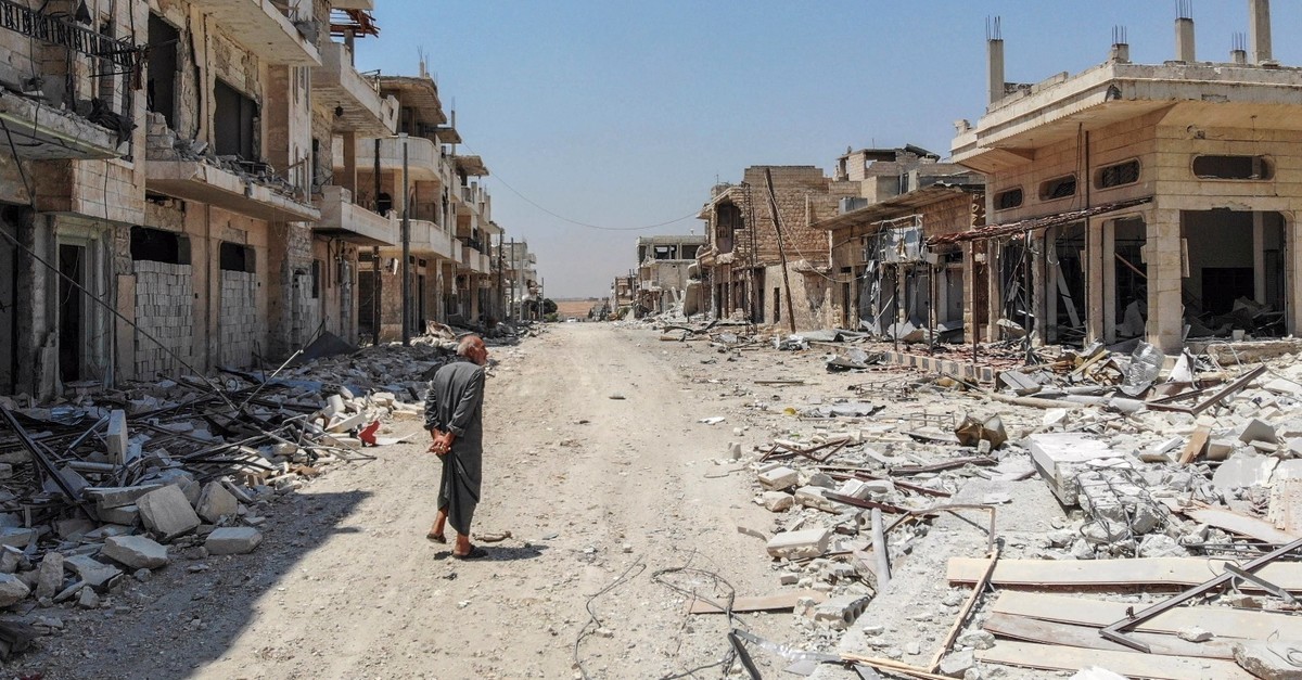 A Syrian man inspects the damage from Assad regime bombing in the town of Khan Sheikhun, Idlib, northern Syria, Aug. 3, 2019.