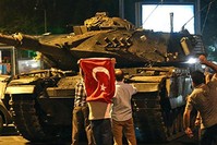 Civilians confront a tank commanded by putschists in the u00c7engelku00f6y district in u00dcsku00fcdar, Istanbul on July 15, 2016. 