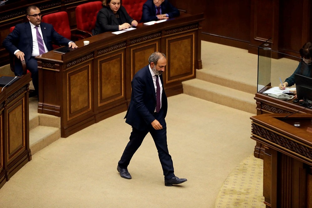 Opposition lawmaker Nikol Pashinian, center, during a parliament session to choose a replacement of Prime Minister in Yerevan on Tuesday, May 1, 2018. (AP Photo)