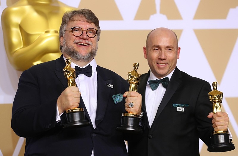 Guillermo del Toro and J. Miles Dale after winning Best Picture and Best Director awards for ,The Shape of Water.,  (Reuters Photo)