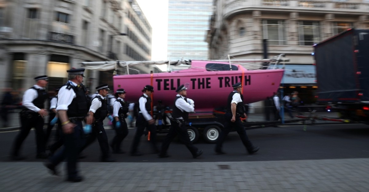 A boat which was parked at Oxford Circus is towed away, during the Extinction Rebellion protest in London, Britain April 19, 2019. (Reuters Photo)