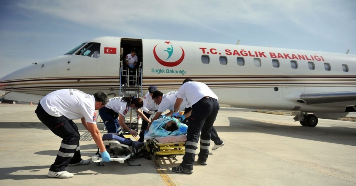 Paramedics carry a patient to an air ambulance of the Health Ministry in this undated photo.