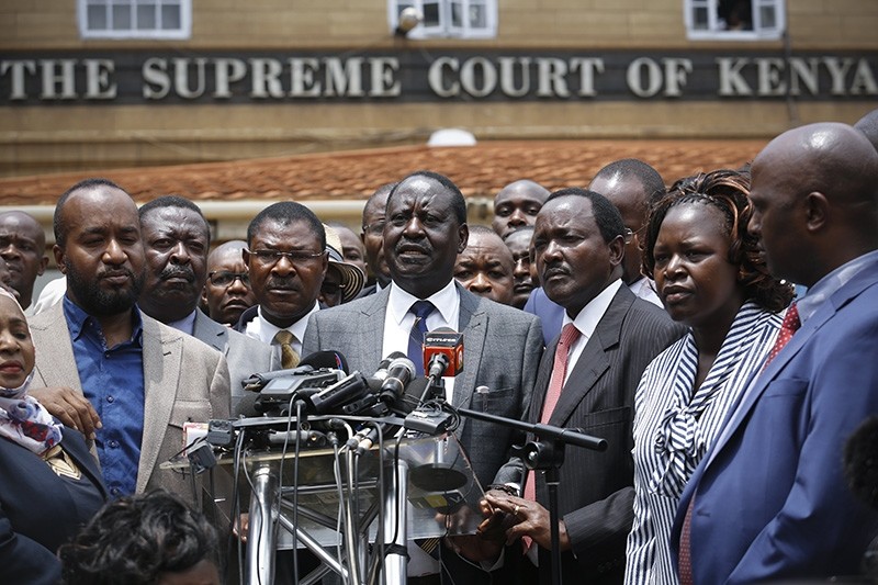 The leader of The National Super Alliance (NASA) opposition coalition and candidate Raila Odinga (C) speaks to the media in front of the Supreme Court after the court ruled in favor of him in central Nairobi, Kenya, Sept. 01, 2017. (EPA Photo)