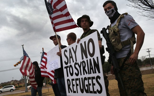 Armed protesters of a far-right U.S. group during a demonstration against Muslim refugees in front of a mosque in Richardson, Texas, Dec. 12, 2015.
