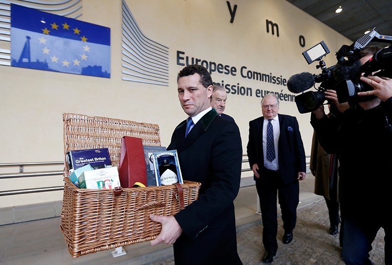 Member of the European Parliament (MEP) Steven Woolfe holds an hamper with British products as he arrives for a meeting with European Union's chief Brexit negotiator Michel Barnier (unseen) at the EU Commission headquarters (Reuters File Photo)