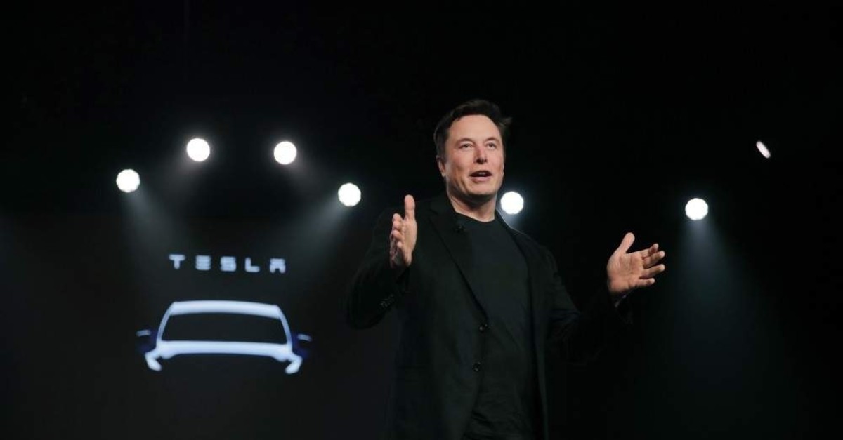 In this file photo, Tesla CEO Elon Musk speaks before unveiling the Model Y at Tesla's design studio in California,  March 14, 2019, (AP)