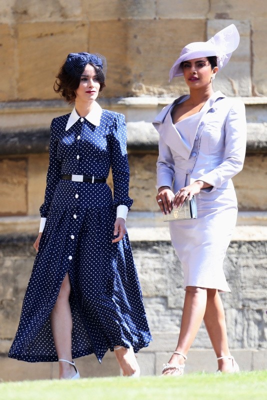 Meghan Markle's friend, US actress Abigail Spencer and Meghan Markle's friend, Indian actress Priyanka Chopra (R) arrive for the wedding ceremony of Britain's Prince Harry, Duke of Sussex and US actress Meghan Markle at St George's Chapel, Windsor Castle, in Windsor, on May 19, 2018.