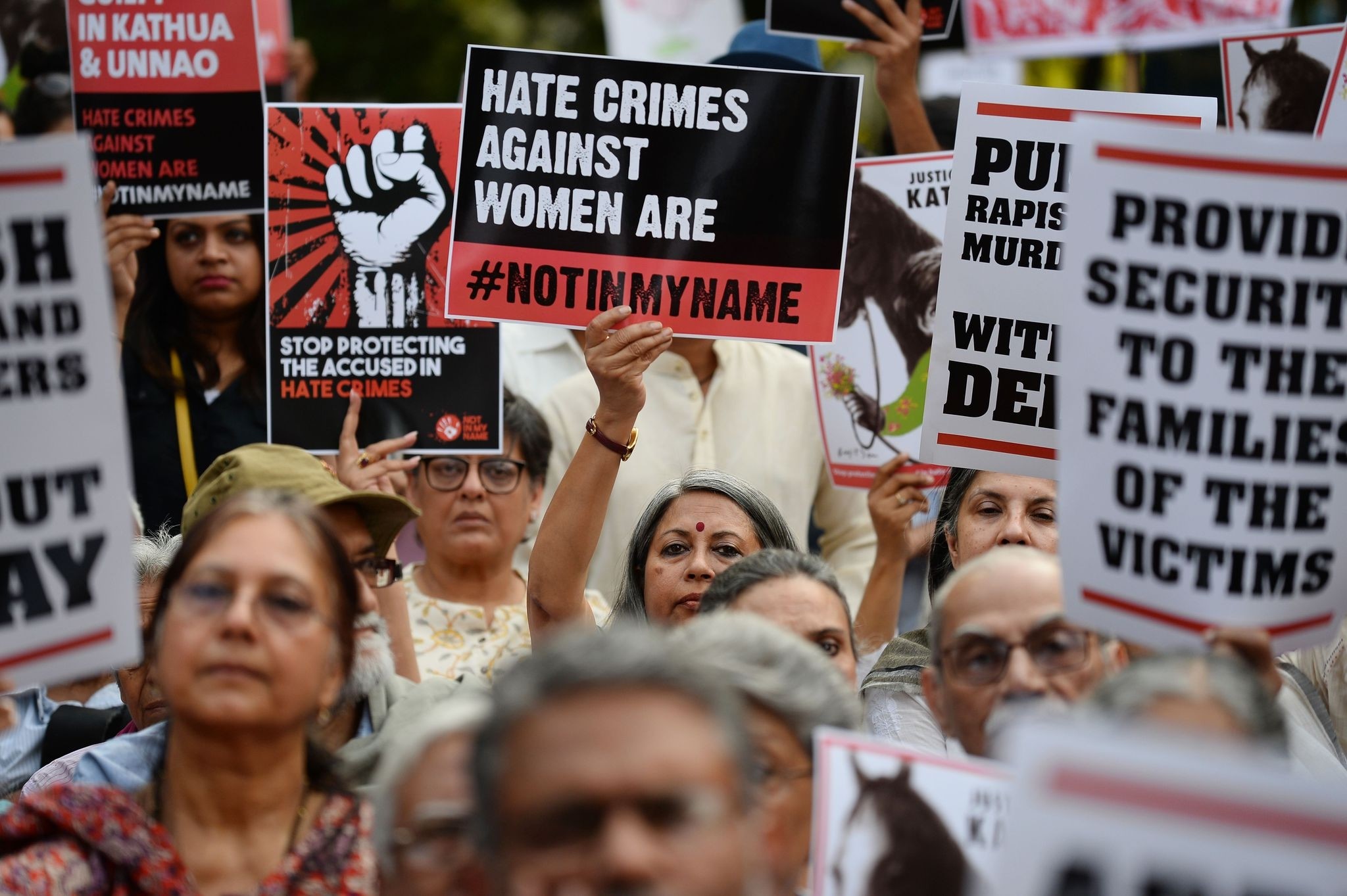  In this file photo taken on April 15, 2018 Indian demonstrators hold placards during a 'Not In My Name' protest in support of rape victims following high profile cases in Jammu and Kashmir and Uttar Pradesh states, in New Delhi. (AFP Photo)