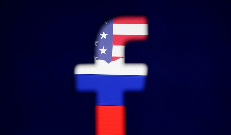 A 3D printed Facebook logo is seen in front of a displayed Russian flag (bottom) in this photo illustration taken on August 3, 2018. (REUTERS Photo)