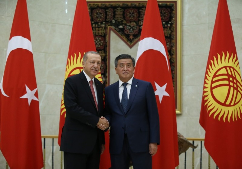 This Sept. 2, 2018 photo shows President Recep Tayyip Erdou011fan shaking hands with Kyrgyzstan's President Sooronbay Jeenbekov. (AA Photo)