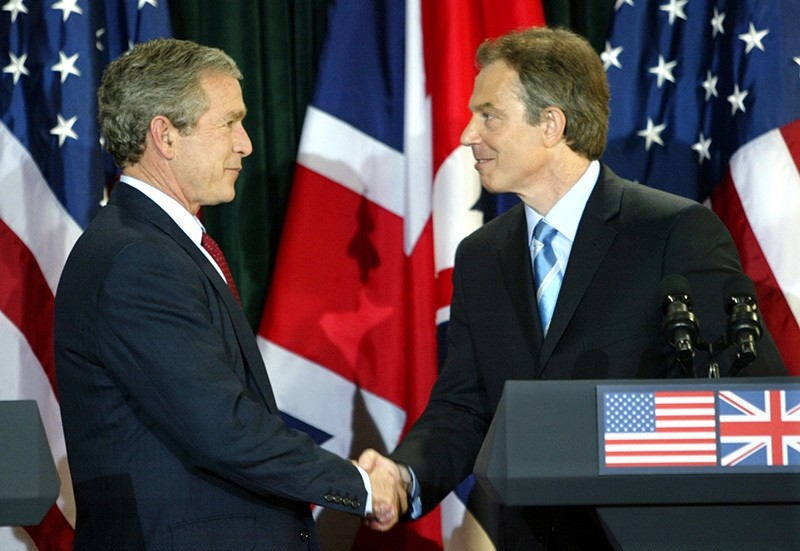 President George W. Bush and British Prime Minister Tony Blair shake hands after a joint press conference following their meeting at Hillsborough Castle near Belfast April 8, 2003. (Reuters Photo)