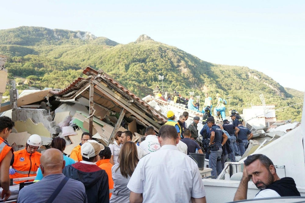 Rescuers at work amongst rubble and damaged houses the day after the earthquake in Ischia, Italy, Aug. 22.