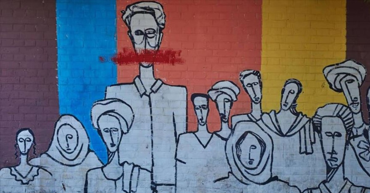 A wall painted by graffiti artists in Sudan describes the mood of the people.