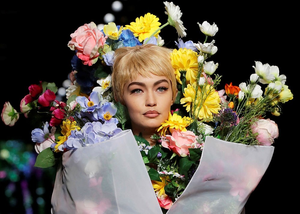 Gigi Hadid wears a creation as part of the Moschino women's Fall/Winter 2018/19 fashion collection, presented in Milan, Italy. (AP Photo)