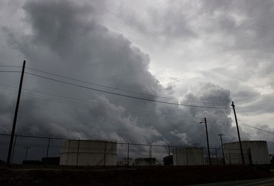 Storm clouds rise above fuel storage tanks as rain from Hurricane Florence falls in Wilmington, North Carolina on Sept. 13, 2018. (AFP Photo)