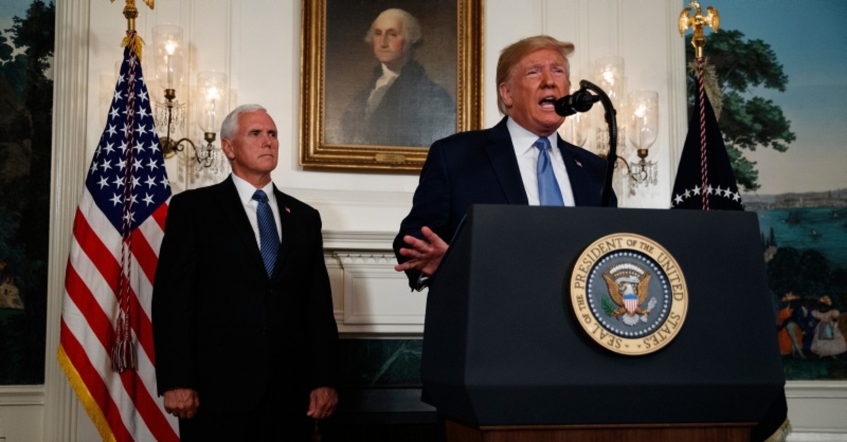 Vice President Mike Pence listens as President Donald Trump speaks about the mass shootings in El Paso, Texas and Dayton, Ohio, in the Diplomatic Reception Room of the White House, Monday, Aug. 5, 2019, in Washington. (AP Photo)