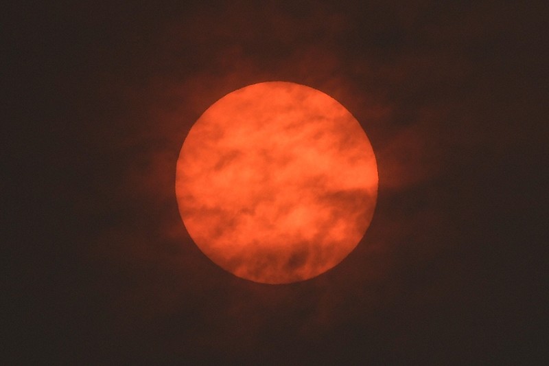 The sun is seen after dawn after the Met Office reported that storm Ophelia has drawn dust north from the Sahara, near Exeter, Britain October 16, 2017. 