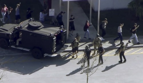 In this frame grab from video provided by WPLG-TV, students from the Marjory Stoneman Douglas High School in Parkland, Fla., evacuate the school following a shooting, Wednesday, Feb. 14, 2018 (AP Photo)