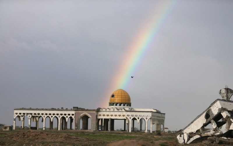 This Jan. 2, 2016 photo shows a rainbow over the former Gaza international airport that was destroyed by Israeli airstrikes, during a rainy day in Gaza. (Reuters Photo)