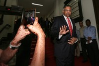 Natarajan Chandrasekaran (R), newly appointed chairman of Tata Group, exits after speaking to the media at Bombay House, the Tata Group head office in Mumbai.