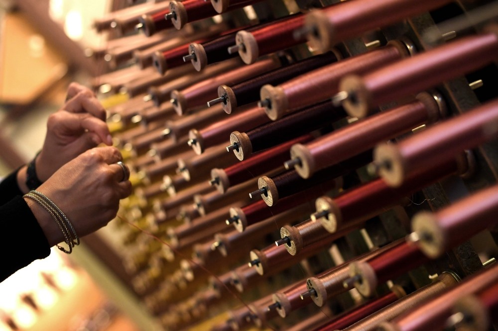 A close-up view of reels of thread in the laboratory of Antico setificio Fiorentino ancient silk factory in Florence. - Antico Setificio Fiorentino was founded in 1786 and is one of the oldest silk workshops in Europe.
