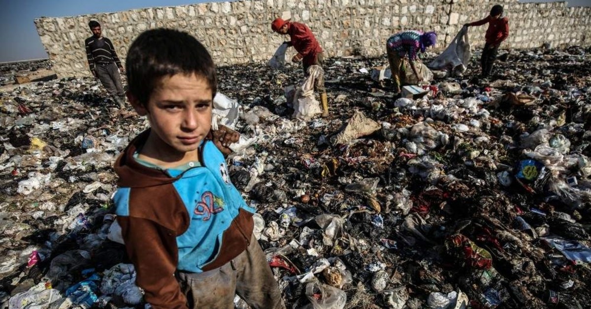 Children has to work in garbage dumps to make their ends meet in Idlib, Nov. 19, 2019. AA