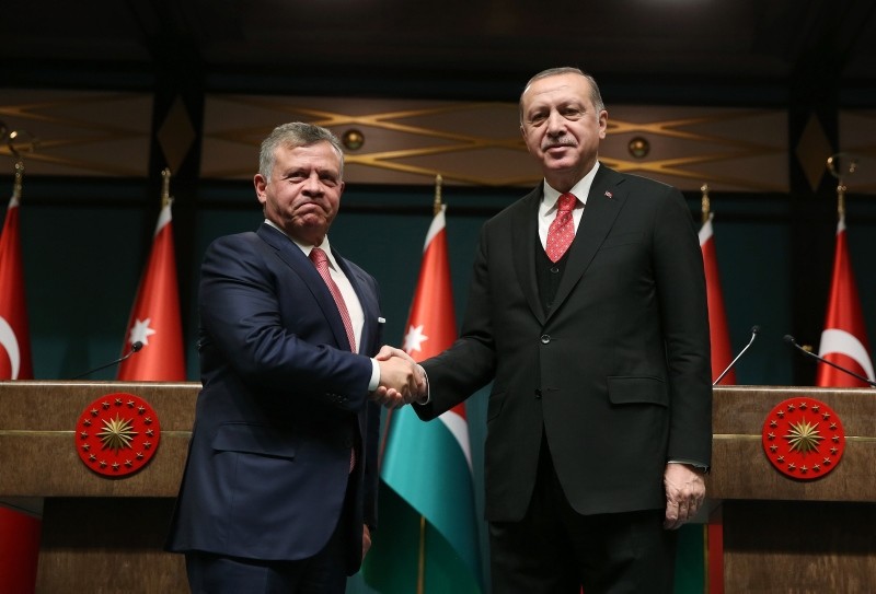 Jordanian King Abdullah II and President Recep Tayyip Erdou011fan shake hands after a joint press conference at the Beu015ftepe Presidential Palace in Ankara, Sep. 12, 2017. (IHA Photo)