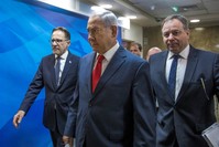 Israeli Prime Minister Benjamin Netanyahu arrives to the weekly cabinet meeting at his office in Jerusalem, August 12, 2018.  (Pool via Reuters)