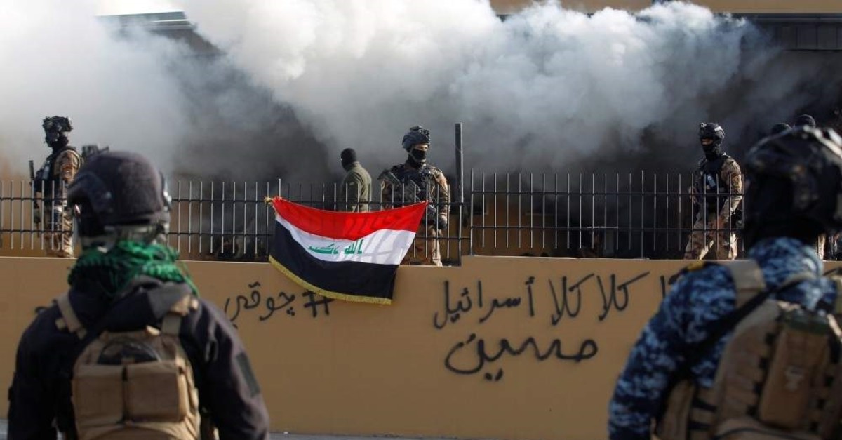 Members of Iraqi security forces are seen in front of the U.S. Embassy, Baghdad, Jan. 1, 2020. (REUTERS Photo)