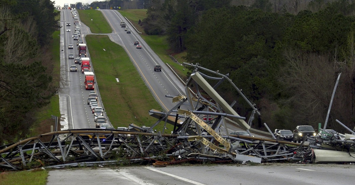 A fallen cell tower lies across U.S. Route 280 highway in Lee County, Ala., in the Smiths Station community after what appeared to be a tornado struck in the area Sunday, March 3, 2019. (AP Photo)
