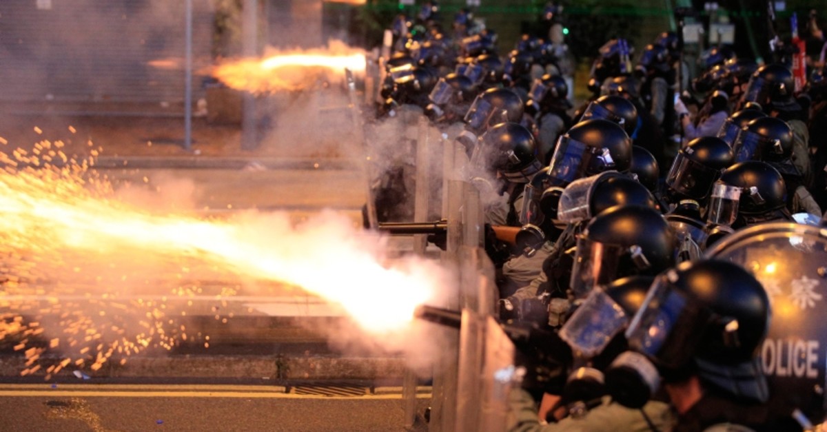 Hong Kong police fire tear gas at protesters in Sai Wan on Sunday, July 28, 2019. (Jeff Cheng/HK01 via AP)