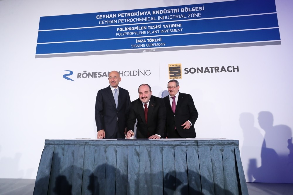 Industry and Technology Minister Mustafa Varank (C), Ru00f6nesans Holding Chairman Erman Ilu0131cak (L) and Algeriau2019s Sonatrach CEO Abdelmoumen Ould Kaddour (R) attend the signing ceremony for the construction of a polypropylene production plant in Adana
