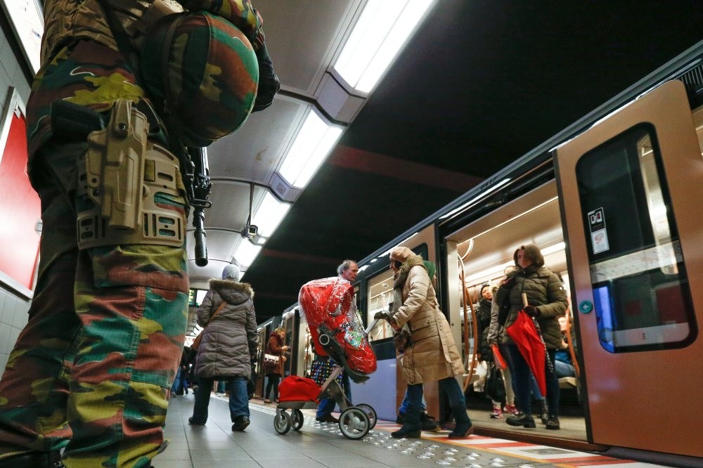 Belgian soldiers observes the platform of a metro station in Brussels. Experts suggest Daesh militants freed by the YPG and U.S. could pose a grave threat to countries that the militants return to. 