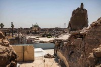 A view of the damaged site of the Great Mosque of al-Nuri in Iraq's war-ravaged Old City of Mosul and the base of the destroyed Al-Hadba leaning minaret, Aug.10, 2019. (AFP PHOTO)