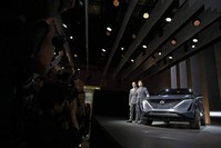 Alfonso Albaisa, left, senior vice president for Global Design for Nissan Motor Corp., and Kunio Nakaguro, executive vice president, pose for photos during Nissan's presentation of the media preview of the Tokyo Motor Show, Oct. 23, 2019, in Tokyo. (AP Photo)