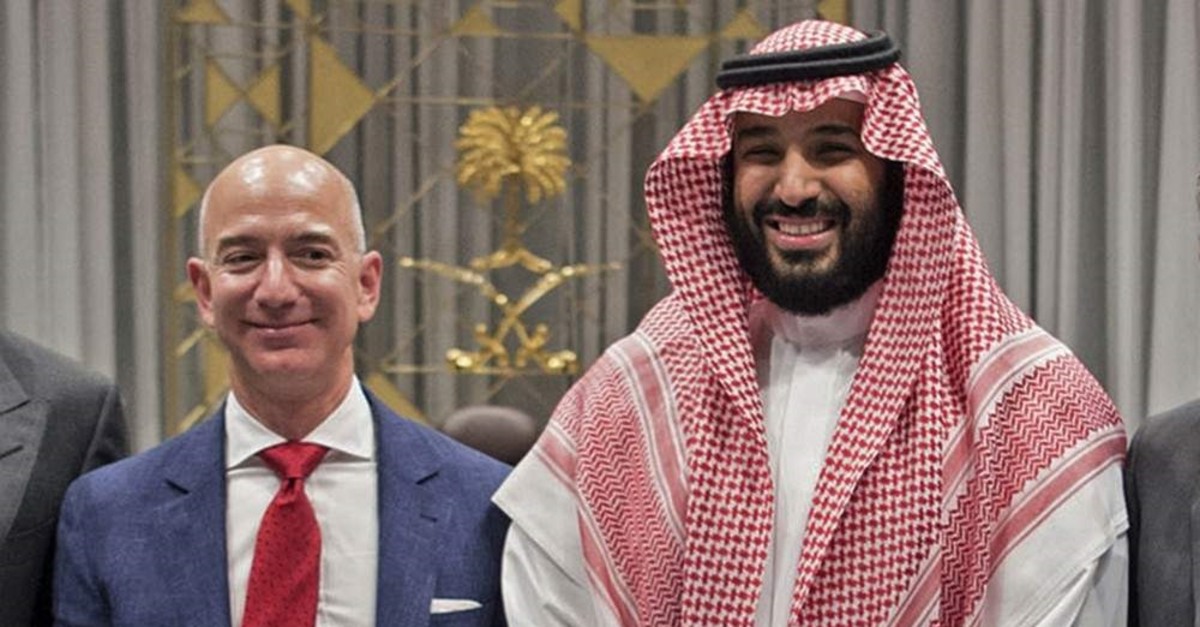 This Nov. 9, 2016, photo released by the Saudi Royal Palace shows Saudi Crown Prince Mohammed bin Salman (R) posing with Amazon CEO Jeff Bezos. (AFP Photo/Saudi Royal Palace/Bandar al-Jaloud)