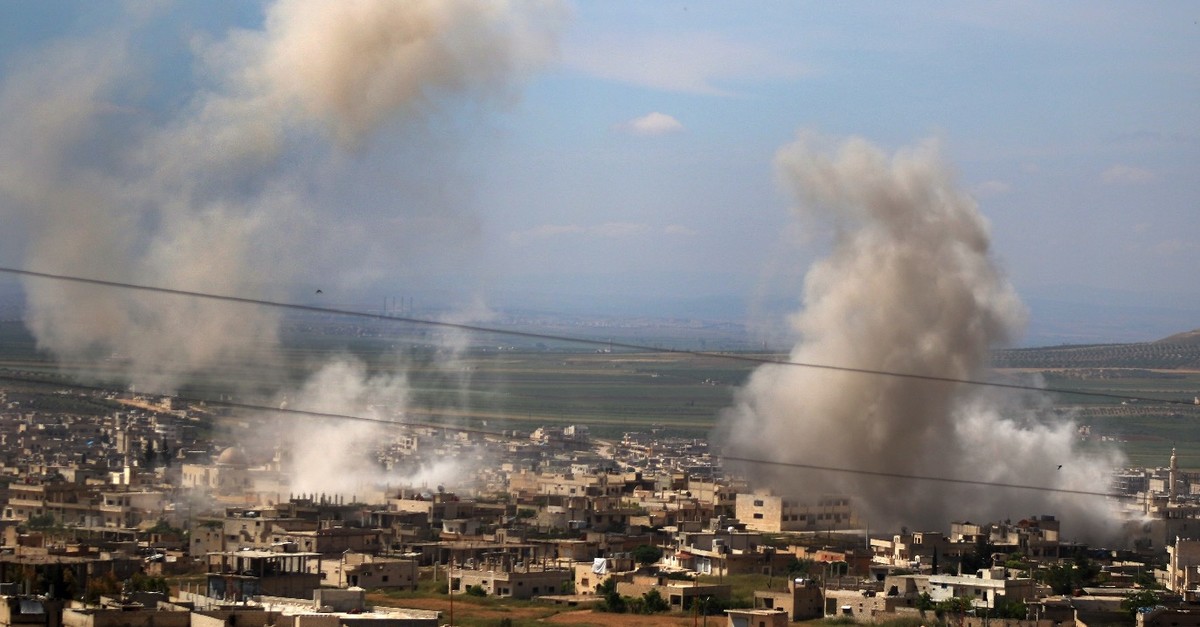 Smoke billows following intense shelling in Khan Sheykun in Syriau2019s northwestern Idlib province, May 10, 2019.