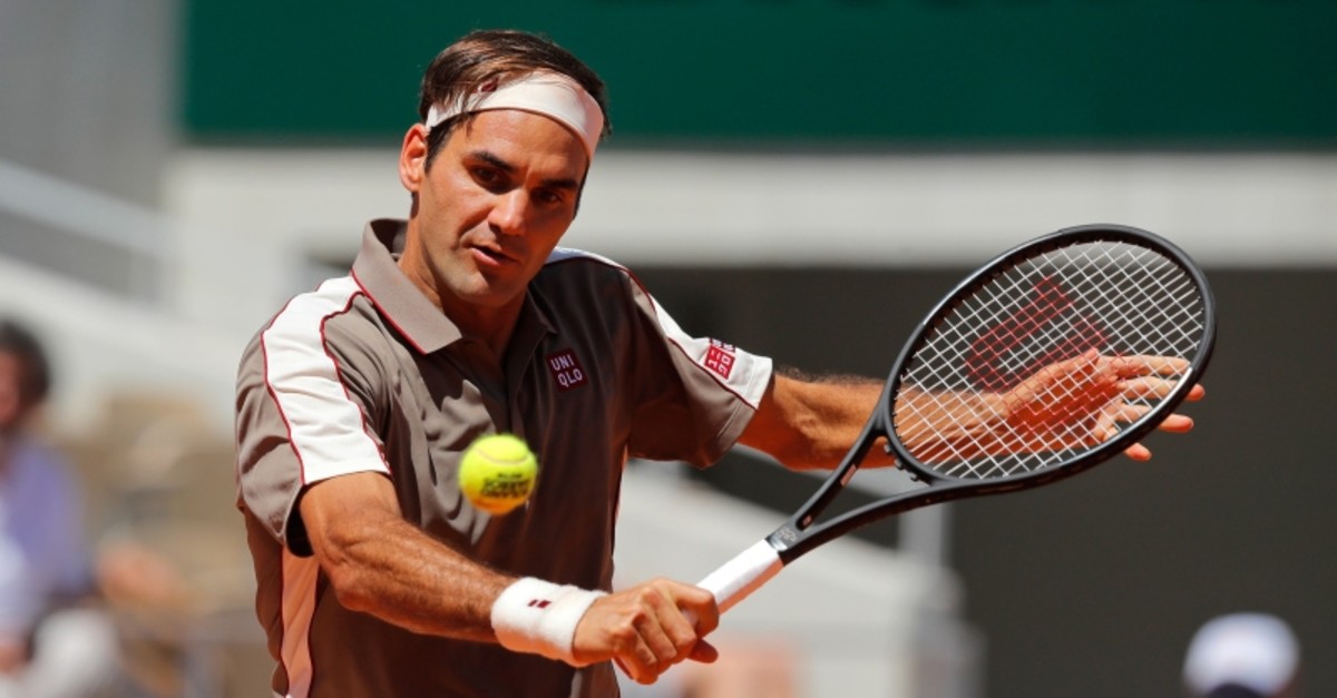 Switzerland's Roger Federer plays a shot against Argentina's Leonardo Mayer during their fourth round match of the French Open tennis tournament at the Roland Garros stadium in Paris, Sunday, June 2, 2019. (AP Photo)