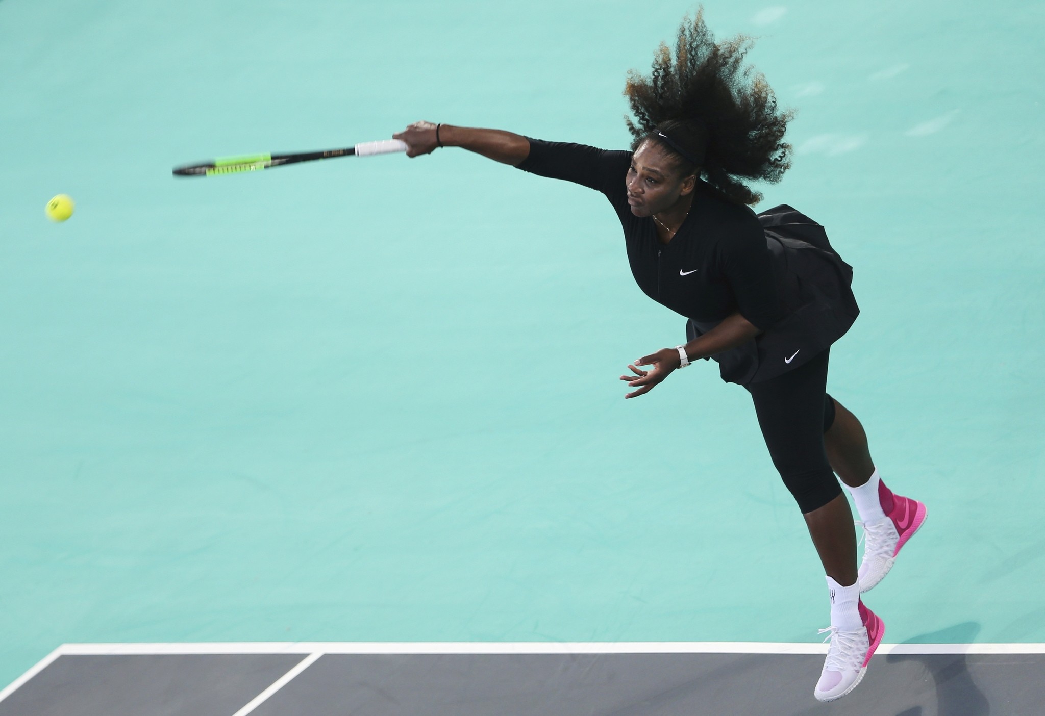 Serena Williams, of the U.S., serves the ball to Jelena Ostapenko, of Latvia, during the final day of the Mubadala World Tennis Championship in Abu Dhabi, Saturday, Dec. 30, 2017. (AP Photo)