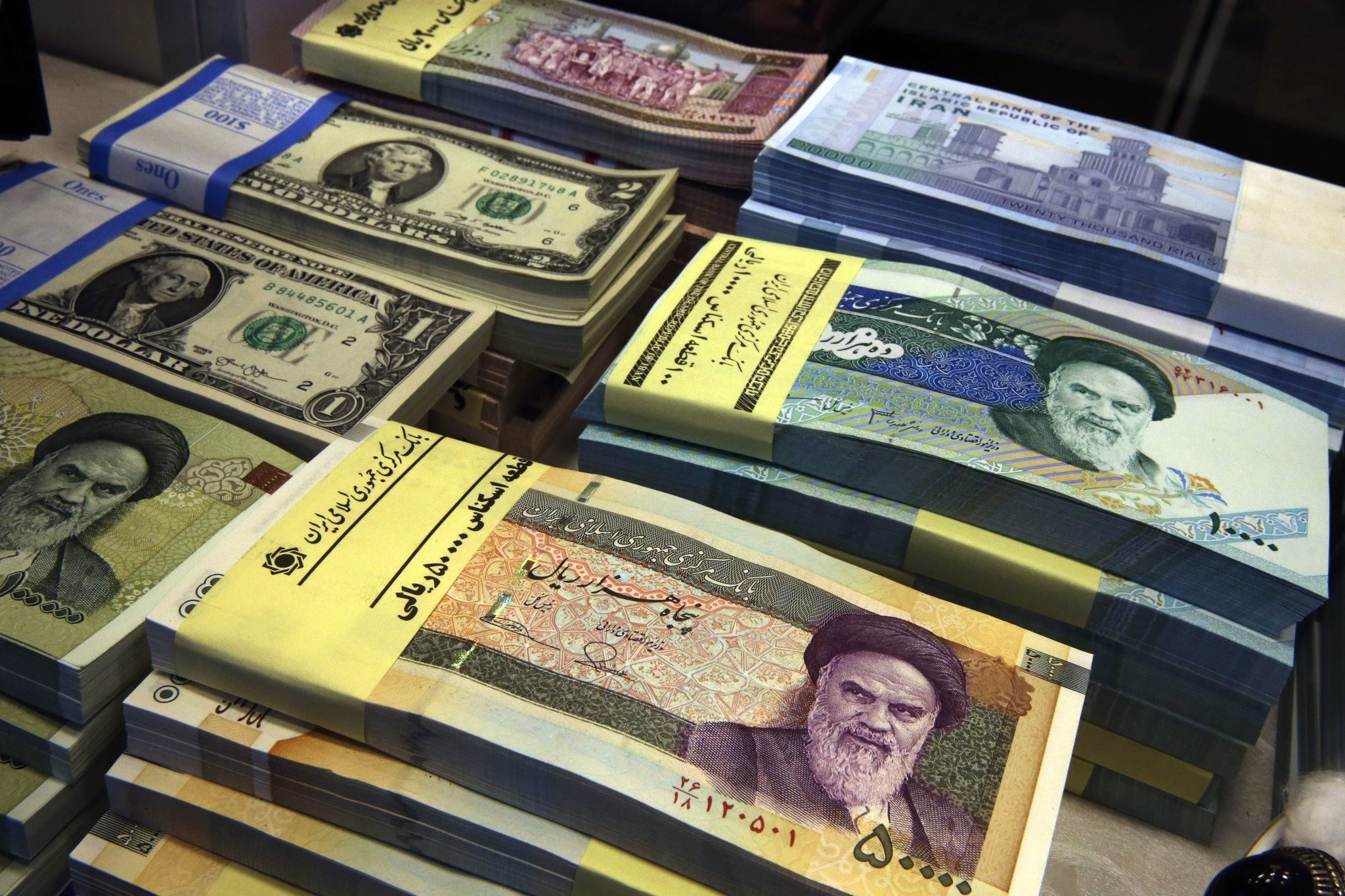  In this April 4, 2015 photo, Iranian and U.S. banknotes are on display at a currency exchange shop in downtown Tehran, Iran. (AP Photo)
