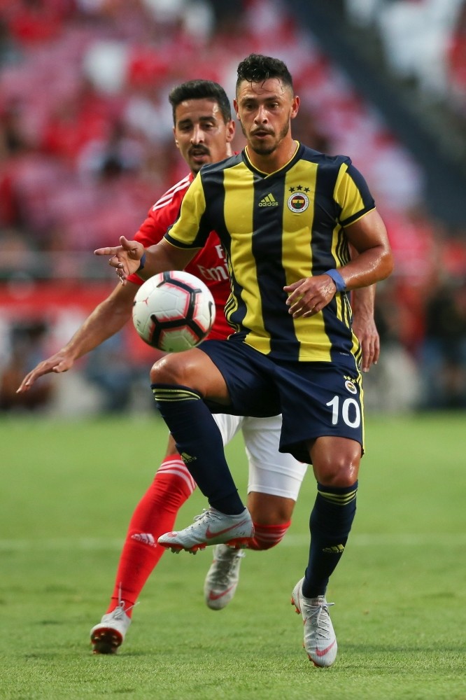 Benfica's player, Andre Almeida (L), in action against Fenerbahu00e7e player, Giuliano, during their Champions League third qualifying round first leg match in Lisbon, Aug. 7.