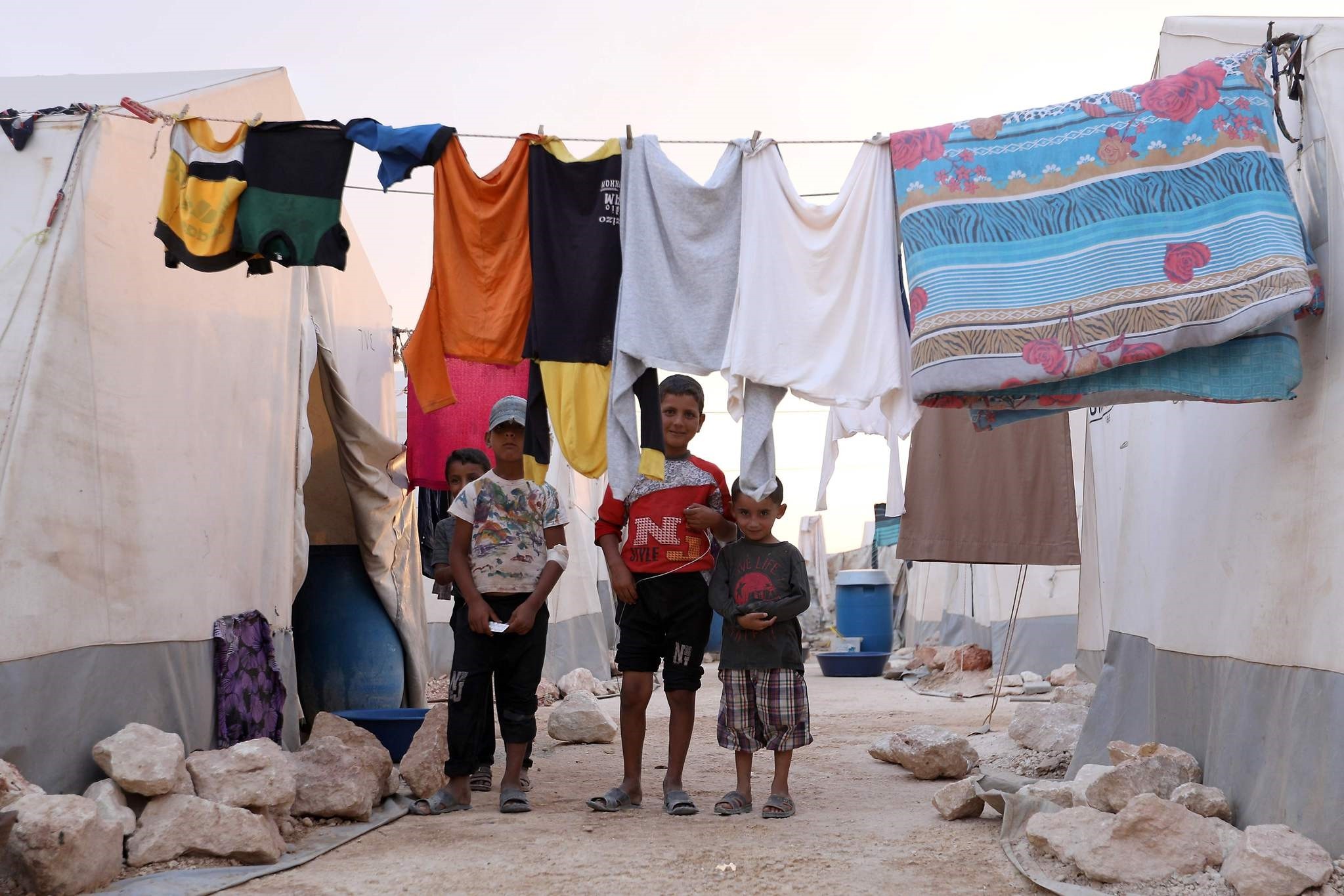 Displaced Syrian children pose for a photograph in a refugee camp near the Turkish-Syrian border, Sept. 13.