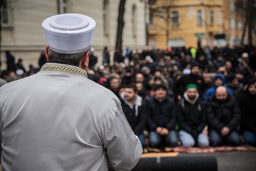 The imam addresses the community prior to the prayer on the street in front of the Koca Sinan Mosque in Berlin on March 16.
