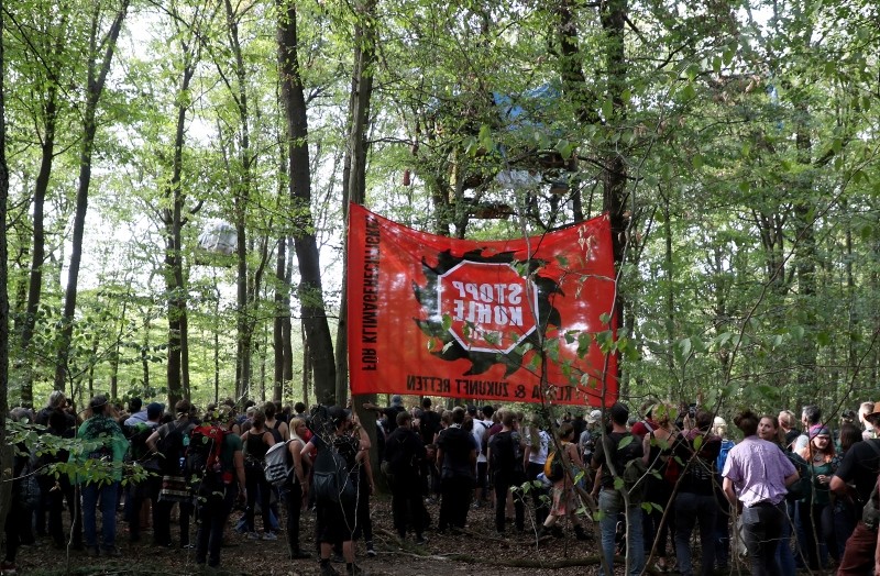 Demonstrators in the forest during a searching and clearing operation at an environmental activists camp in the forest Hambacher Forst in Morschenich, Germany, 16 September 2018. (EPA Photo)