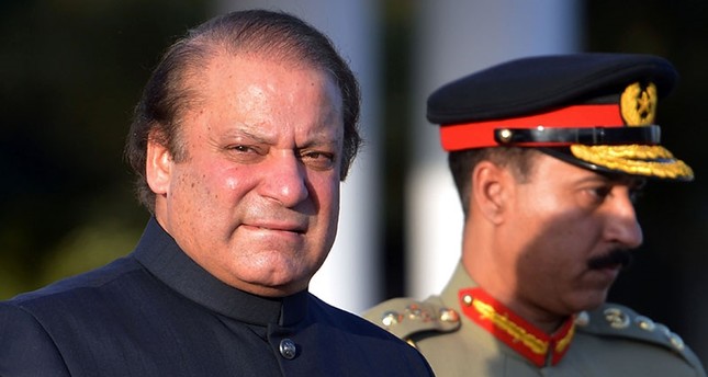 In this file photograph taken on June 5, 2013, Pakistani Prime Minister Nawaz Sharif arrives to inspect a guard of honour during a welcoming ceremony at the Prime Minister's House in Islamabad. (AFP Photo)