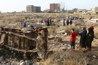 People visit the graves of their loved ones during the first day of the Muslim holiday of Ramadan Bayram (Eid al-Fitr) in Raqqa, Syria, June 5, 2019. 
