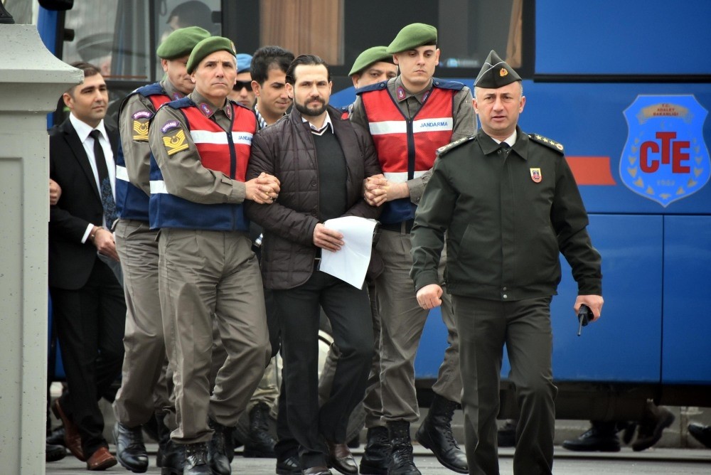 Gendarmerie officers escort Ali Saru0131bey to the courtroom. Saru0131bey, a lieutenant who was in the team of assassins sent to kill Erdou011fan, testified at yesterday's hearing in the city of Muu011fla.